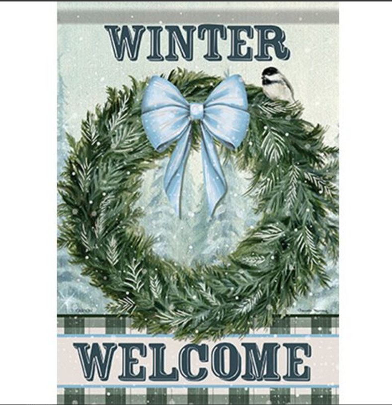 Winter welcome sign with a wreath and blue bow on a checkered background