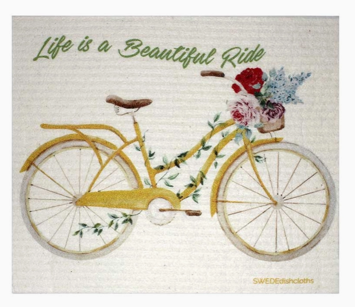 Yellow bicycle with flowers on a textured background with 'Life is a Beautiful Ride' text.